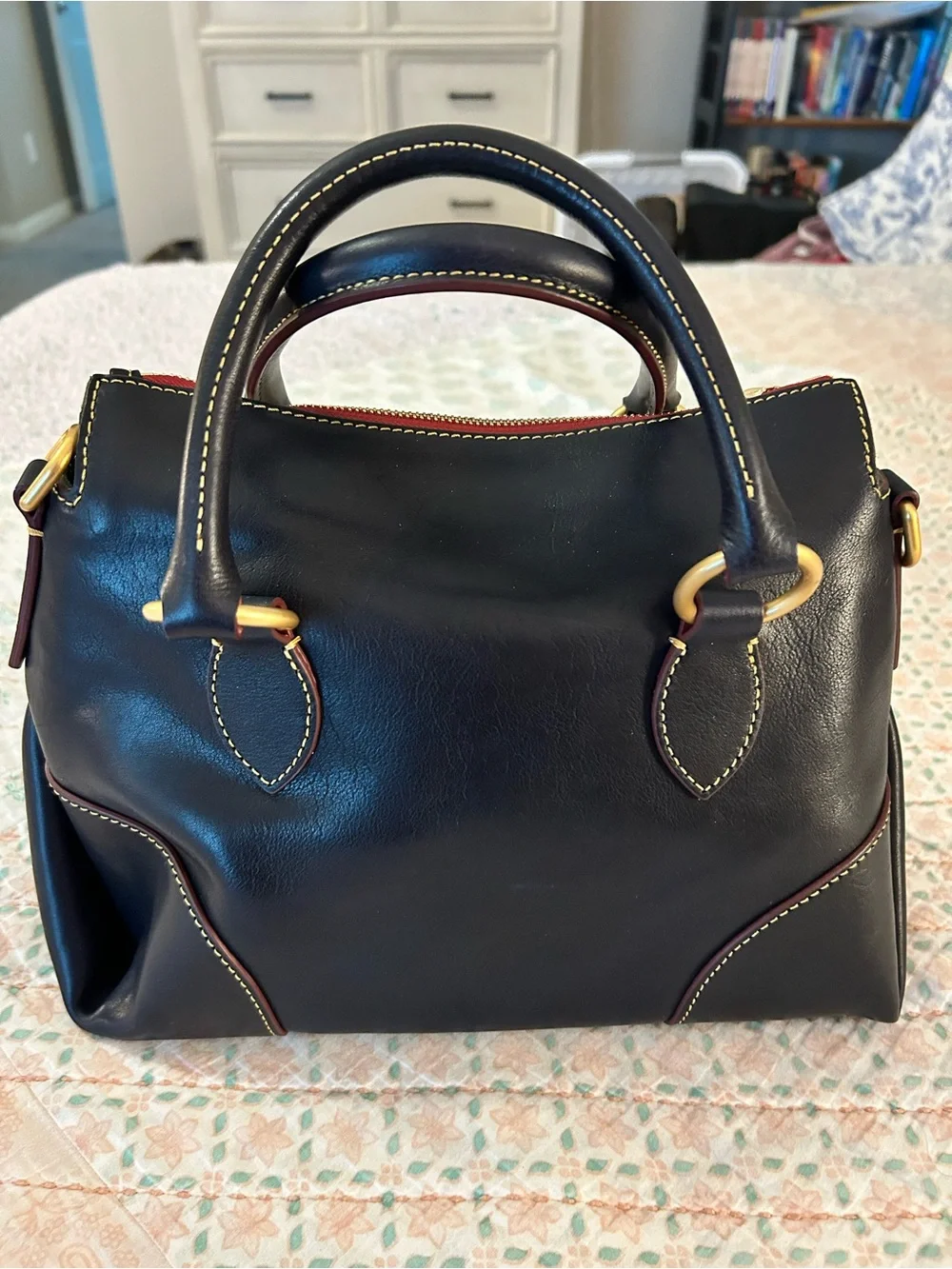 Dooney and Bourke Florentine Satchel 30 in the color Navy. EUC comes w/bag charm